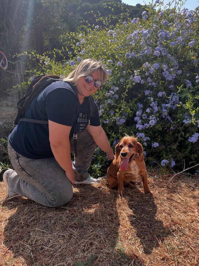 Dog walking on a green trail in Carcavelos